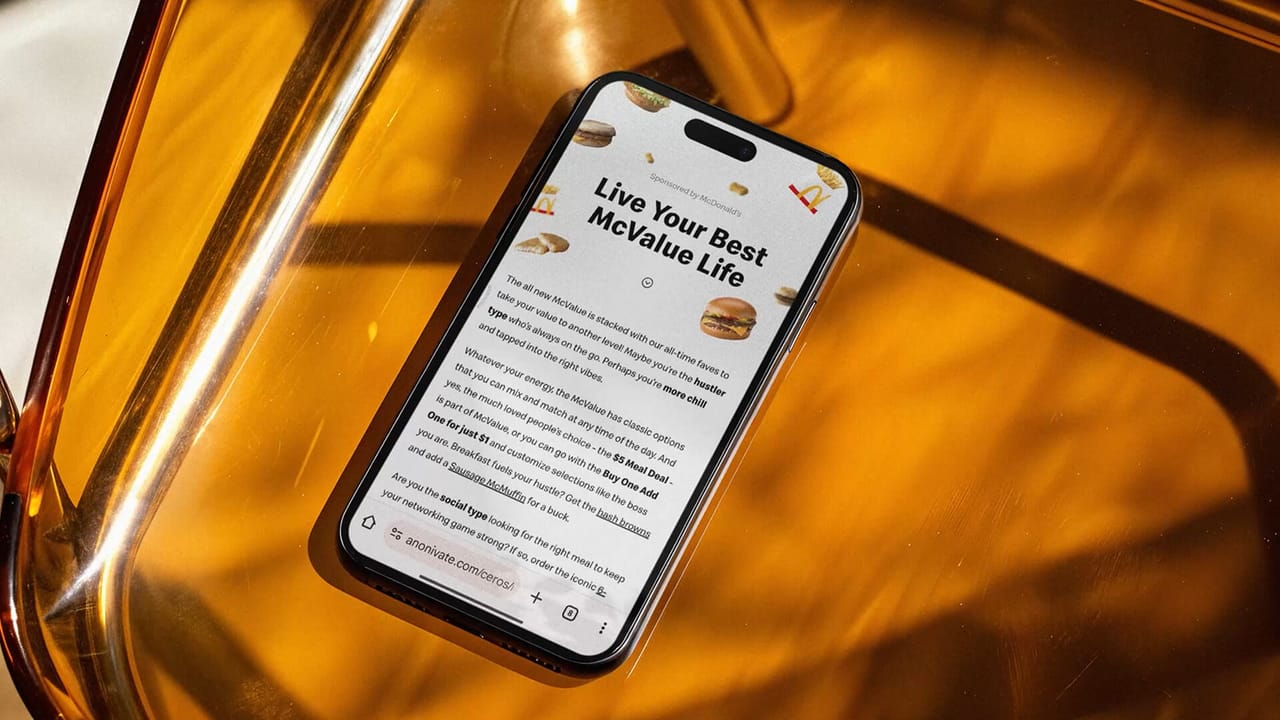 The Live Your Best McValue Life experience open on a phone against amber glass
