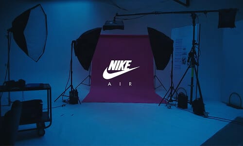 Studio set lit around a magenta backdrop for the Nike Air shoot