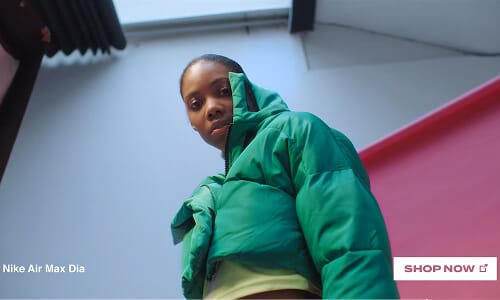 End frame — the green puffer look with a Shop Now prompt