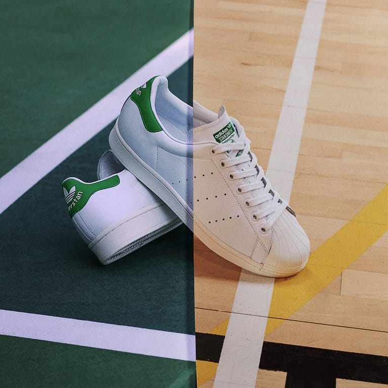 A pair of Superstans, the frame split between tennis court and basketball court